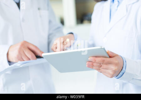 people doing chemical experiment in modern lab Stock Photo