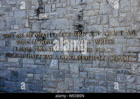 A quote by former  Penn State head coach Joe Paterno on the wall by his statue at Beaver Stadium  in State College, Pennsylvania on November 12, 2011. It reads,  'They ask me what I'd like written about me when I'm gone, I hope they write I made Penn State a better place, not just that I was a good football coach'  . Coach Paterno was fired following the arrest of former assistant coach Jerry Sandusky on allegations of child abuse earlier in the week.   UPI/Archie Carpenter Stock Photo