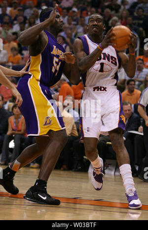 Phoenix Suns center Amare Stoudemire (1) drives to the basket as Los Angeles Lakers Kwame Brown (54) defends during second half action of the second game of the first round of the NBA Playoffs at the US Airways Center in Phoenix, Arizona on April 24, 2007.  The Suns defeated the Lakers 126-98. (UPI Photo/Art Foxall) Stock Photo