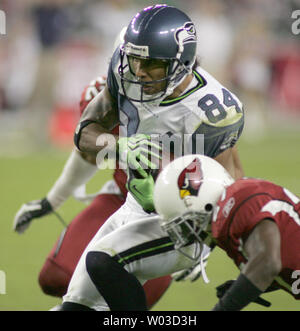 Seattle Seahawks' T.J. Houshmandzadeh (84) stretches on the field prior to  a NFL football game on Sunday, Nov. 22, 2009 against Minnesota Vikings at  the Metrodome in Minneapolis. (AP Photo/Hannah Foslien Stock