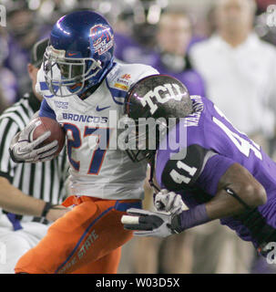 Boise State running back Jeremy Avery (L) is pushed out of bounds by Texas Christian University's Daryl Washington (R) after a short gain during the first quarter of the Fiesta Bowl at University of Phoenix Stadium in Glendale, AZ, January 4,2010.  (UPI/Art Foxall) Stock Photo