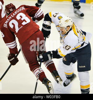Nashville Predators Colin Wilson (R) checks Phoenix Coyotes Oliver Ekman-Larsson (L) in the first period of the second game of the second round of the NHL Stanley Cup Playoffs at Jobing.Com Arena in Glendale, Arizona, April 29, 2012.  UPI/Art Foxall Stock Photo
