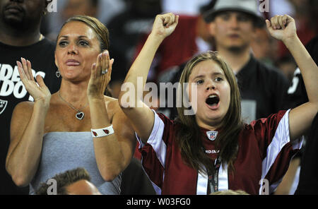 Arizona Cardinals fans applaud the action on the field during the Cardinals-Oakland Raiders pre-season game at University of Phoenix Stadium in Glendale, Arizona, August 17,2012.  The Cardinals beat the Raiders 31-27. UPI/Art Foxall Stock Photo