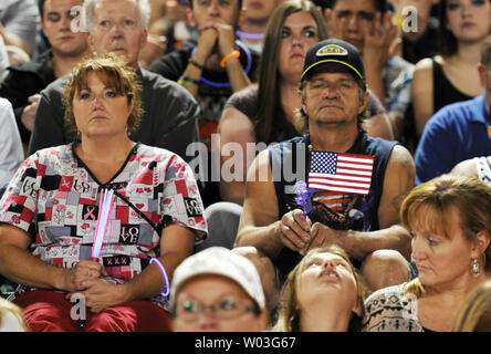 People attend a memorial service for the nineteen Granite Mountain Hotshots, killed Sunday fighting the Yarnell Hill Fire, in Prescott, Arizona on July 2, 2013.   UPI/Art Foxall Stock Photo