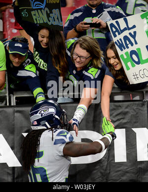 Seattle Seahawks running back Alex Collins carries the ball against the  Denver Broncos during the first half of an NFL football preseason game,  Saturday, Aug. 21, 2021, in Seattle. (AP Photo/John Froschauer