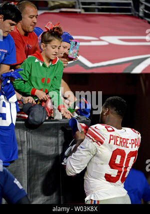 New York Giants' Jason Pierre-Paul (R) signs autographs for fans after the Giants lost to the Arizona Cardinals 23-0 at University of Phoenix Stadium in Glendale, Arizona December 24, 2017. Photo by Art Foxall/UPI Stock Photo