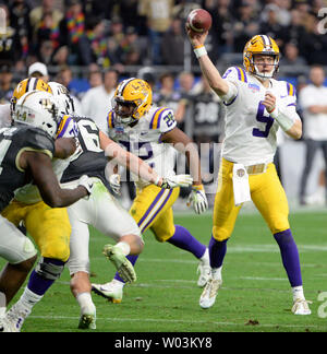 FILE - In this Jan. 1, 2019, file photo, LSU quarterback Joe Burrow attends  warmups before the Fiesta Bowl NCAA college football game against UCF in  Glendale, Ariz. This year, a group