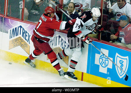 Carolina Hurricanes' Rod Brind'Amour, left, shakes hands