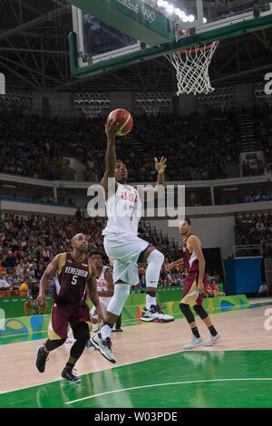 United States guard Kyle Lowry (7) comes in for the dunk shot after slipping past Venezuela point guard Gregory Vargas (5) during basketball competition at the Rio Olympic Games at the Carioca Arena 1 in Rio de Janeiro, Brazil, August 8, 2016. The USA team overcame a slow start coasting to an easy 113-69 win over Venezuela.     Photo by Richard Ellis/UPI Stock Photo