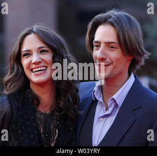 Asia Argento (L) and husband Michele Civetta arrive on the red carpet before a screening of the film 'Dream Rush' during the 4th Rome International Film Festival in Rome on October 19, 2009.   UPI Photo/David Silpa Stock Photo