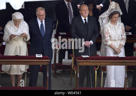 Belgium's Queen Paola (L) and King Albert II  attend canonization mass with Spain's King Juan Carlos and Queen Sofia (R)  as Pope Francis honors Pope John XXIII and Pope John Paul II by declaring them saints in St. Peter's Square at the Vatican in Vatican City on April 27, 2014.  About 800,000 people filled the square for the ceremony.   UPI/Stefano Spaziani Stock Photo