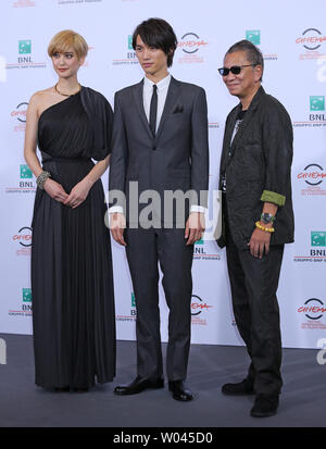 Hirona Yamazaki L Sota Fukushi C and Takashi Miike arrive at