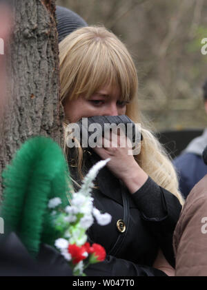 Mourners attend a funeral service for victims of a bus crash, in Santo