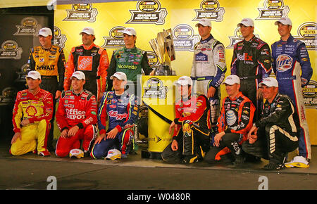 Tony Stewart, Left, And Kevin Harvick Stand On Pit Road Prior To The 