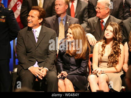 California Governor Arnold Schwarzenegger, wife Maria Shriver laugh as Willie Brown speaks during the gubenatorial inauguration at the Memorial Auditorium in Sacramento, California on January 5, 2007. Daughter Katherine is at right.   (UPI Photo/Aaron Kehoe) Stock Photo