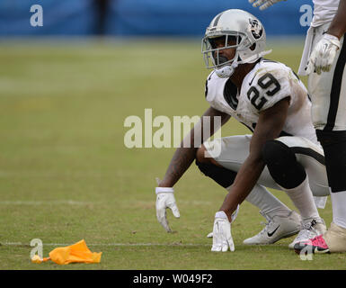 Oakland Raiders cornerback David Amerson (29) defends a pass intended for  San Diego Chargers wide receiver Dontrelle Inman (15) during the second  half of an NFL football game in Oakland, Calif., Thursday