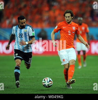 Daley Blind of the Netherlands competes with Ezequiel Lavezzi (L) of Argentina during the 2014 FIFA World Cup Semi Final match at the Arena Corinthians in Sao Paulo, Brazil on July 09, 2014. UPI/Chris Brunskill Stock Photo