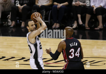 Miami Heat guard Ray Allen (34) defends against San Antonio Spurs guard Manu Ginobili (20) in game 2 of the NBA Finals at the AT&T Center in San Antonio, Texas on June 8, 2014. The Heat defeated the Spurs 98-96 to tie the series at 1-1 in the best of seven series.     UPI/Aaron M. Sprecher Stock Photo