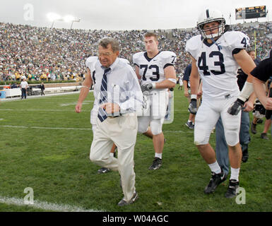 Penn State head coach Joe Paterno heads off the field with linebacker Josh Hull (43) and guard Dennis Landolt (73) as Notre Dame defeated Penn State 41-17 at Notre Dame stadium in South Bend, IN September 9, 2006. (UPI Photo/Mark Cowan) Stock Photo