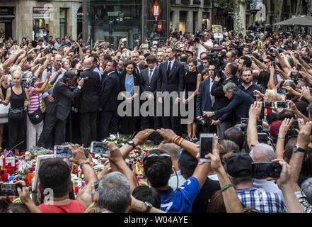 Spain's King Felipe VI (CL) and Spain's Queen Letizia (CR) pay tribute for the victims of the Barcelona attack on Las Ramblas boulevard next to President of Catalonia Carles Puigdemont in Barcelona on August 19, 2017, two days after a van plowed into the crowd, killing 14 persons and injuring over 100. photo by Angel Garcia/ UPI Stock Photo