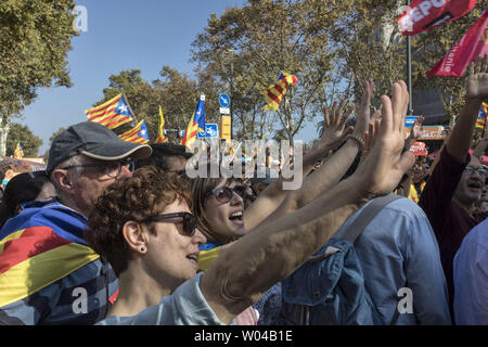 People gather to celebrate the proclamation of a Catalan republic at the Sant Jaume Square in Barcelona in Spain, on October 27, 2017. Catalonia's regional parliament voted to declare independence from Spain today just as the Spanish Parliament voted to impose direct rule on the region from Madrid.   Photo by Xavi Herrero/ UPI Stock Photo