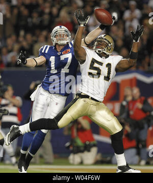 New Orleans Saints line backer Troy Evans (54) holds up a Champion towel  after the Saints defeated the Indianapolis Colts 31-17 in Super Bowl XLIV  at Sun Life Stadium in Miami on