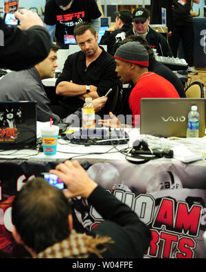 Actor Hugh Jackman (C) and Sugar Ray Leonard (R) are interviewed on Radio Row at the Super Bowl XLV Media Center in Dallas, Texas, on February 4, 2011. Jackman studied boxing with Sugar Ray Leonard for Jackman's upcoming movie 'Real Steel.'   UPI/Rob Hobson Stock Photo