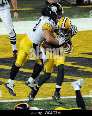 Pittsburgh Steelers strong safety Troy Polamalu (43) watches the replay on  his recovery of a Houston Texans fumble in the fourth quarter of the  Steelers 30-23 winat Heinz Field in Pittsburgh on