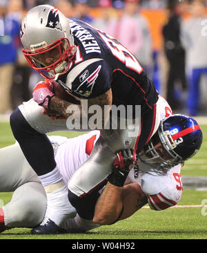 Tight end Aaron Hernandez (81) of the New England Patriots celebrates his  touchdown against the New York Giants on the opening drive of the second  half in Super Bowl XLVI at Lucas