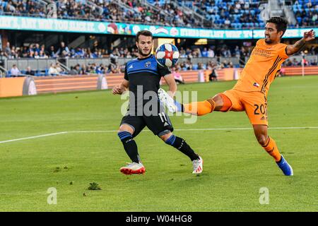 San Jose, California, USA. 26th June, 2019. Houston Dynamo defender A. J. DeLaGarza (20) gets to the ball just ahead of San Jose Earthquakes midfielder Valeri Kazaishvili (11) during the MLS game between The Houston Dynamo and the San Jose Earthquakes at Avaya Stadium in San Jose, California. Chris Brown/CSM/Alamy Live News Stock Photo