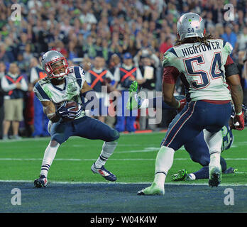 New England Patriots Rob Ninkovich (50) and WR Julian Edelman (R) celebrate  a Malcolm Butler interception of a Seattle Seahawks pass with 26 seconds  remaining in Super Bowl XLIX at University of