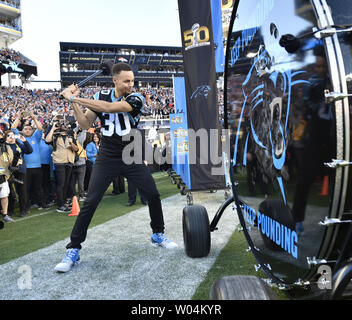 NBA MVP Stephen Curry hits a gong as the Carolina Panthers take the field  to play the Denver Broncos in Super Bowl 50 in Santa Clara, California on  February 7, 2016. Photo