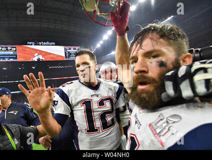 New England Patriots quarterback Tom Brady (L) and wide receiver Julian  Edelman celebrate after defeating the Atlanta Falcons in Super Bowl LI at  NRG Stadium in Houston on February 5, 2017. The Patriots defeated the  Falcons 34-28 in the Super Bowl's