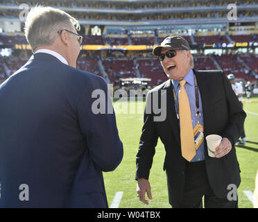 Former NFL quarterback John Elway, center, greets fans while