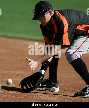 San Francisco Giants' Benito Santiago slides safely below Arizona