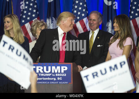 Republican Presidential hopeful Donald Trump delivers remarks to supporters after winning the South Carolina Republican primary at an election night rally in Spartanburg, South Carolina on February 20, 2016. Trump was joined by his daughter Ivanka (L), his wife Melania (R), Lt. Gov. Henry McMaster (R-SC) and McMaster's wife Peggy. Photo by Kevin Dietsch/UPI Stock Photo