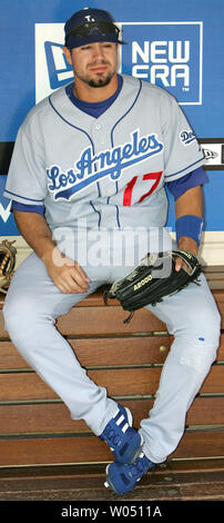 Los Angeles Dodgers' Jason Repko is hit in the elbow by a pitch by ...