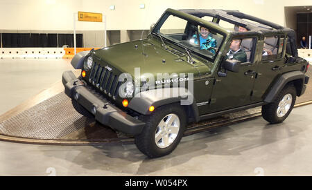 Visitors experience a hands on demo of the Jeep Wrangler Rubicon's  capabilities at the 2010 San Diego International Auto Show at the San Diego  Convention Center on January 2, 2010. UPI/Roger Williams Stock Photo - Alamy