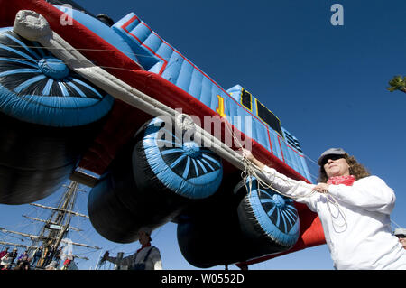 Giant balloons wait in a staging area before the start of the annual 'Port of San Diego Big Bay Balloon Parade,' held in San Diego on December 30, 2010. The parade, recognized as America's largest balloon parade, is held in conjunction with Holiday Bowl festivities. (UPI Photo/Earl S. Cryer) Stock Photo