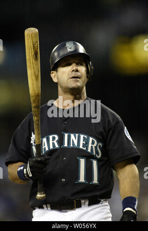 Seattle Mariners' Edgar Martinez watches his sacrifice fly to right field  in the seventh inning against the Oakland Athletics, Friday, Sept. 17,  2004, at Safeco Field in Seattle. The RBI, which scored