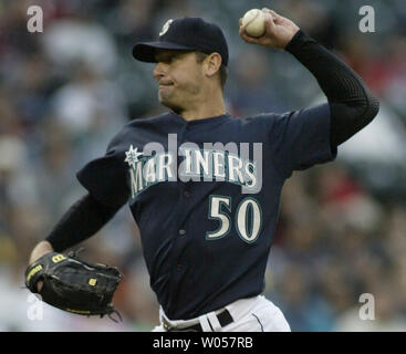 Seattle Mariners starting pitcher Jamie Moyer adjusts his cap after ...