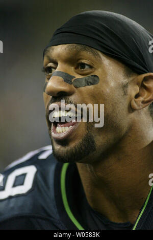 Seattle Seahawks' linebacker Julian Peterson (C) talks with