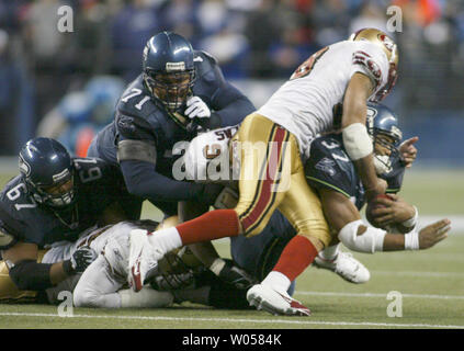 Seattle Seahawks quarter back Matt Hasselbeck (8) passes during second  quarter play at Philadelphia's Lincoln Field December 2, 2007.Keeping him  safe from being sacked is team mate Walter Jones. The Seattle Seahawks