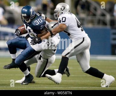 Seattle Seahawks running back Shaun Alexander scores in the first quarter  against the St. Louis Rams at Qwest Field in Seattle on November 13, 2005.  Alexander romped for 165 yards on a