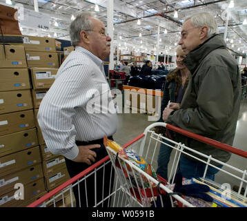 Costco co-founder Jim Sinegal (L) greets Harold and Mary Brown during the grand opening of store in Gig Harbor, WA., on November 2, 2007.  (UPI Photo/Jim Bryant) Stock Photo