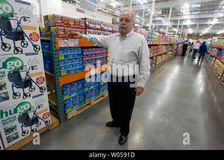 Costco co-founder Jim Sinegal asks an employee about the product  'AirBorne' during the grand opening of store in Gig Harbor, WA., on November 2, 2007.  (UPI Photo/Jim Bryant) Stock Photo