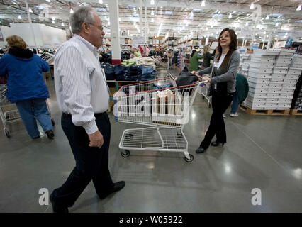 Costco co-founder Jim Sinegal (L) greets store employee Marsha Nichols at the grand opening of store in Gig Harbor, WA., on November 2, 2007.  (UPI Photo/Jim Bryant) Stock Photo