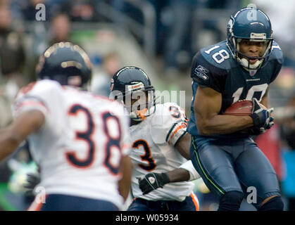 Seattle Seahawks' D.J. Hackett (18) misses catching the ball in the endzone  as Dallas Cowboys' Terence Newman defends in the second quarter in an NFC  wild-card playoff football game Saturday, Jan. 6