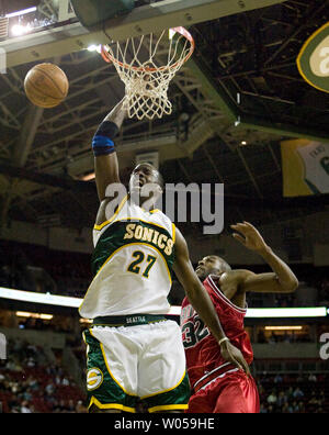 Seattle SuperSonics'  Johan Petro, of France, (27) is fouled by Chicago Bulls'  Joe Smith (R)  during the first half at the Key Arena in Seattle on February 4, 2008. (UPI Photo/Jim Bryant) Stock Photo