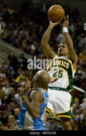 Seattle SuperSonics'  Earl Watson, right, hits a pull up jump shot over defending Denver Nuggets'  Anthony Carter to send the game into double overtime at the Key Arena in Seattle on April 6, 2008.  Watson scored 16 points in the SuperSonics 151-147 win over the Nuggets.  (UPI Photo/Jim Bryant) Stock Photo